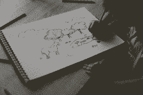 A kid drawing a landscape of nature
