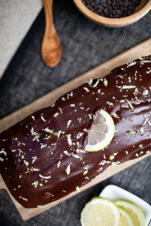 A chocolat cake with some lemon on the top