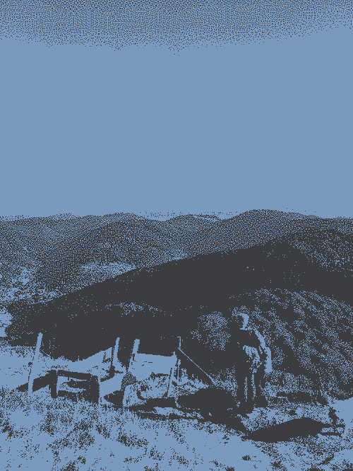 A man and his son before a montain landscape