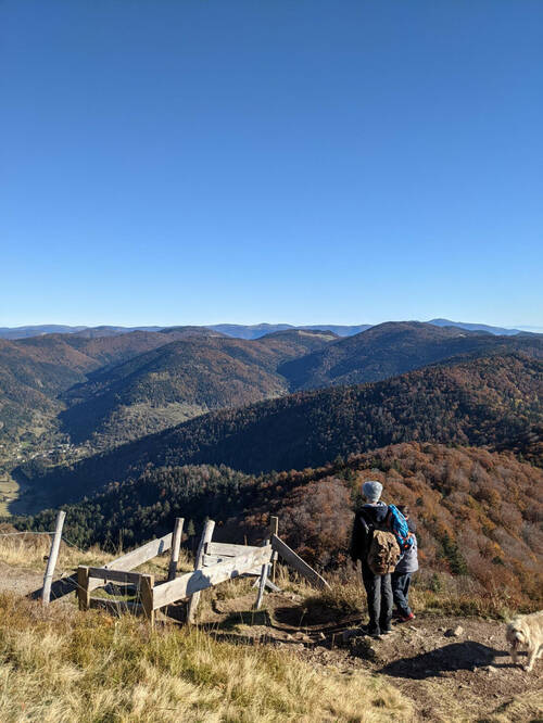 A man and his son before a montain landscape